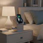 A 3-in-1 magnetic wireless charging station, twisted open, charging an iPhone, Apple Watch, and AirPods on a modern nightstan